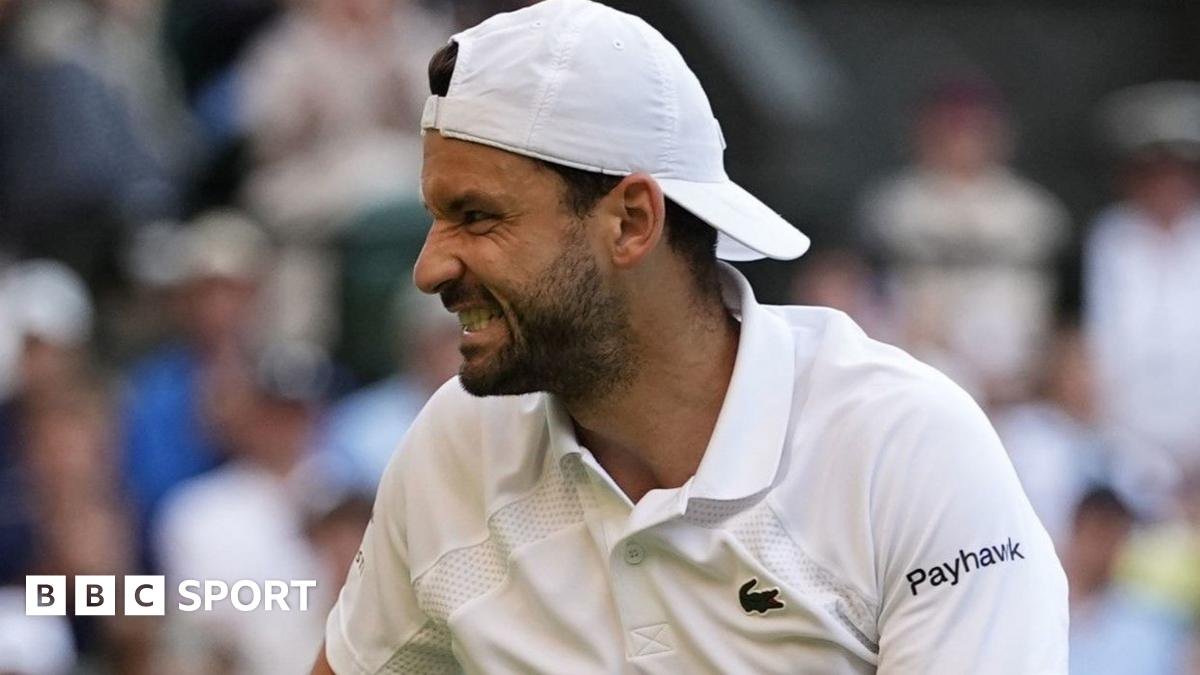Grigor Dimitrov grimaces after injuring himself in last-16 match against Jannik Sinner at Wimbledon