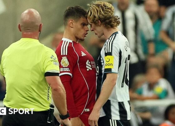 Newcastle's Anthony Gordon, who was sent off for a foul on Virgil van Dijk, squares up to Liverpool's Milos Kerkez
